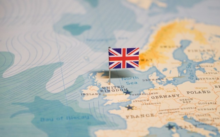 The,Flag,Of,United,Kingdom,On,The,World,Map.