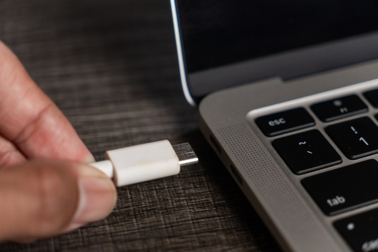 USB being plugged into a laptop