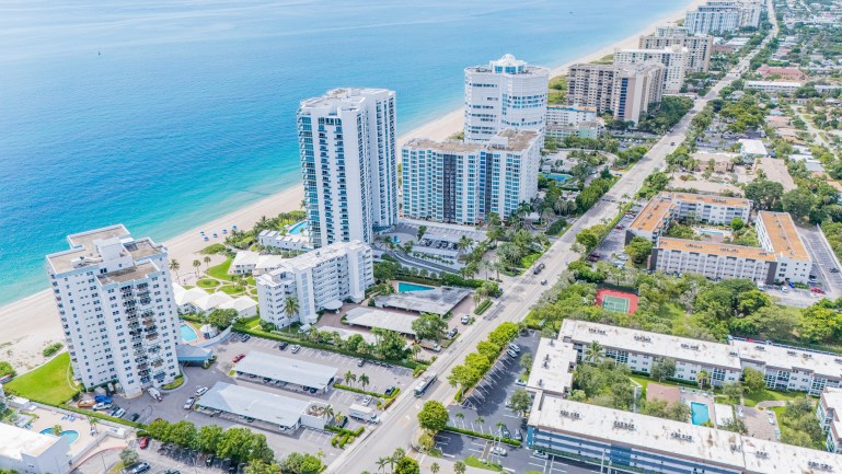 Venture X Expands to Pompano Beach, Fla., With 20,000-Sq.-Ft. Lease Aerial view of Southern Florida city, which includes a few tall office buildings near the seaside.